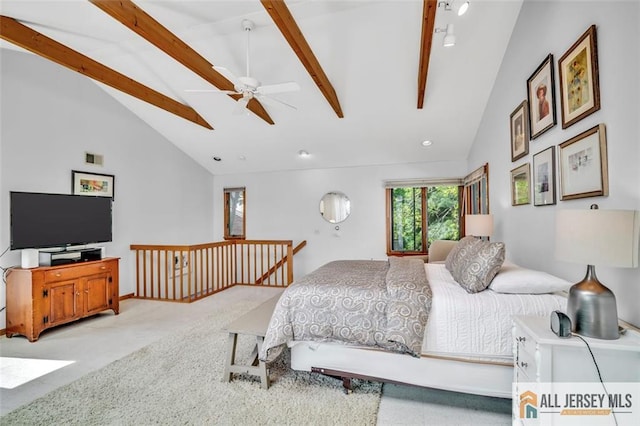 carpeted bedroom with high vaulted ceiling, beamed ceiling, and visible vents