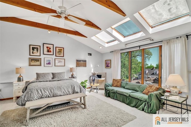 bedroom with baseboards, ceiling fan, and vaulted ceiling with skylight