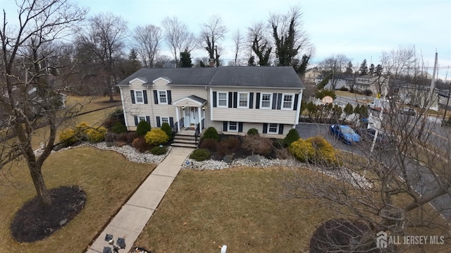 view of front of property with a front lawn