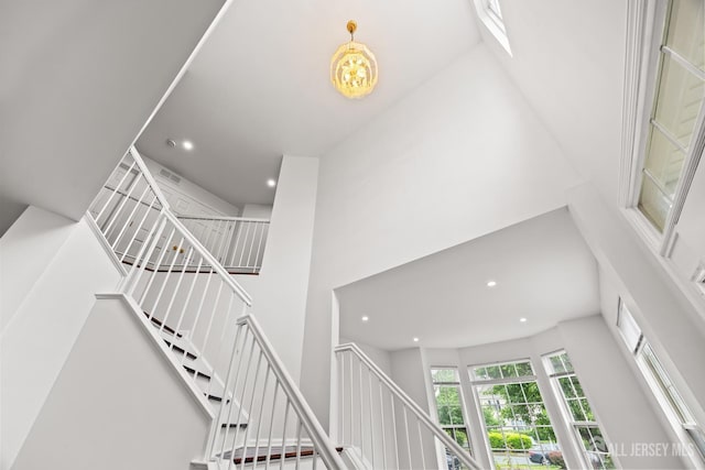 19 Grossweiler Ln, Parlin, NJ 08859 - stairs with a towering ceiling and recessed lighting