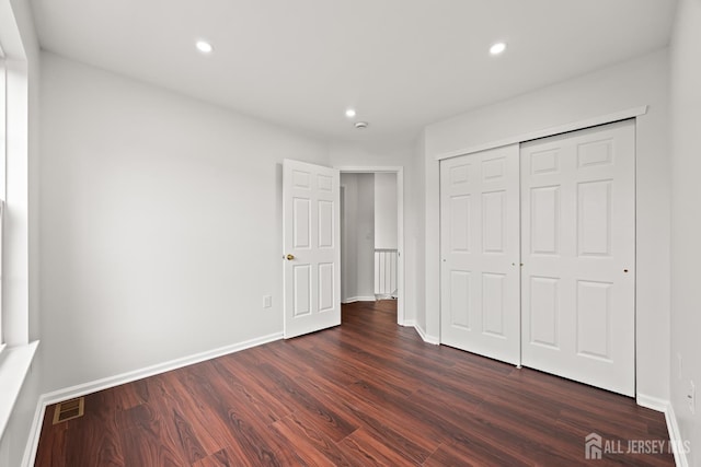 19 Grossweiler Ln, Parlin, NJ 08859 - unfurnished bedroom with dark wood-style floors, recessed lighting, baseboards, and a closet