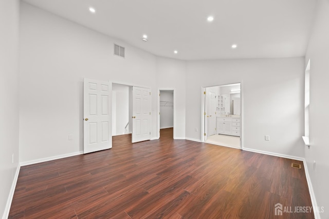 19 Grossweiler Ln, Parlin, NJ 08859 - unfurnished bedroom with dark wood-style floors, baseboards, recessed lighting, a spacious closet, and high vaulted ceiling