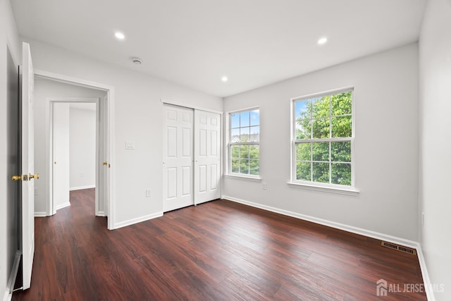 19 Grossweiler Ln, Parlin, NJ 08859 - unfurnished bedroom with dark wood-type flooring, baseboards, recessed lighting, and a closet