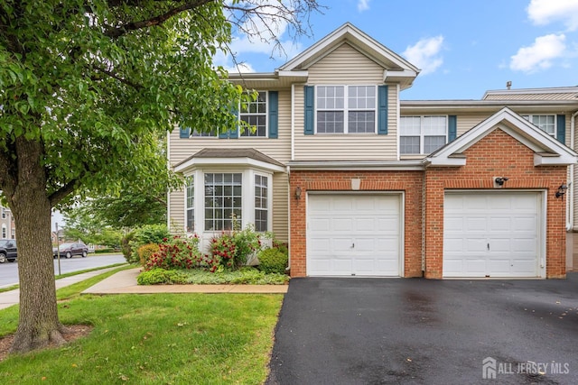 19 Grossweiler Ln, Parlin, NJ 08859 - view of front of property featuring brick siding, driveway, and a front lawn