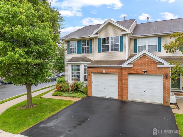 19 Grossweiler Ln, Parlin, NJ 08859 - view of front facade featuring brick siding, driveway, a garage, and a shingled roof