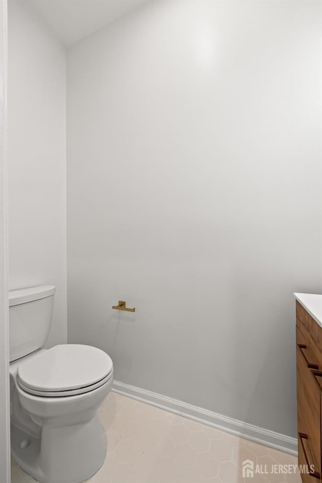 19 Grossweiler Ln, Parlin, NJ 08859 - bathroom with baseboards, vanity, toilet, and tile patterned floors