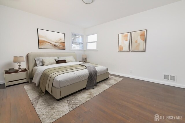 bedroom with hardwood / wood-style floors