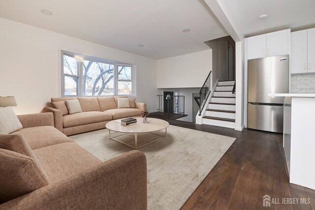 living room featuring dark wood-type flooring