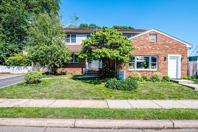 view of front of home with a front yard