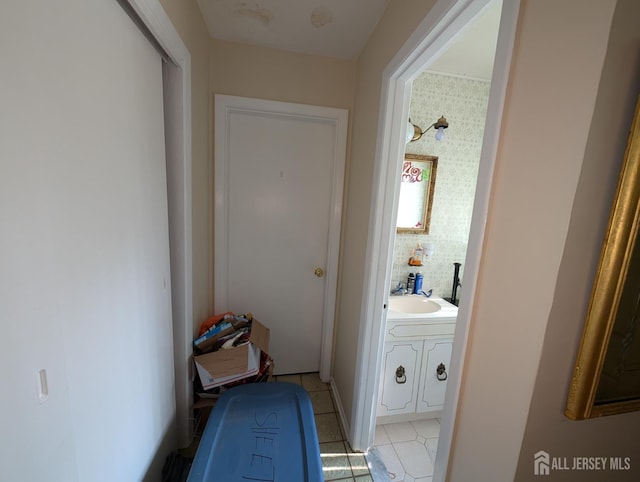 28 Tanglewood Ln, East Brunswick, NJ 08816 - hall with a sink and light tile patterned flooring