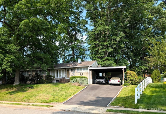 28 Tanglewood Ln, East Brunswick, NJ 08816 - ranch-style house with driveway, a front yard, and a carport