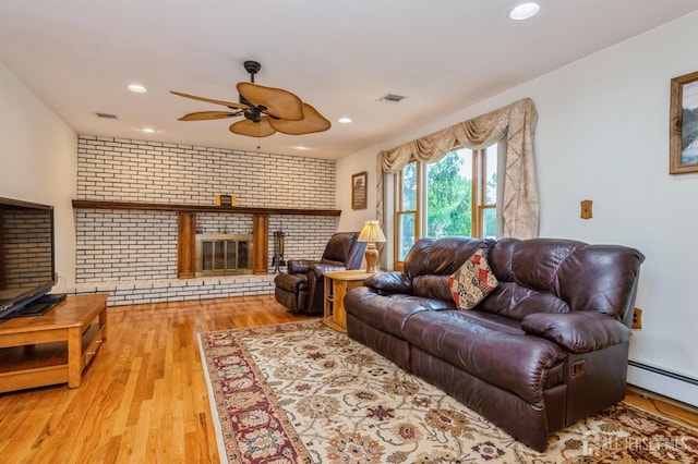 27 Briarwood Dr, Old Bridge, NJ 07747 - living area featuring ceiling fan, a brick fireplace, wood finished floors, recessed lighting, and baseboard heating