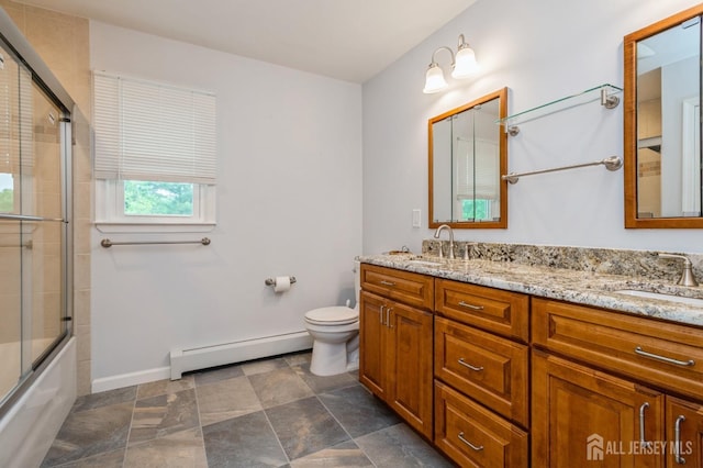 27 Briarwood Dr, Old Bridge, NJ 07747 - bathroom featuring a baseboard radiator, double vanity, toilet, and shower / bath combination with glass door