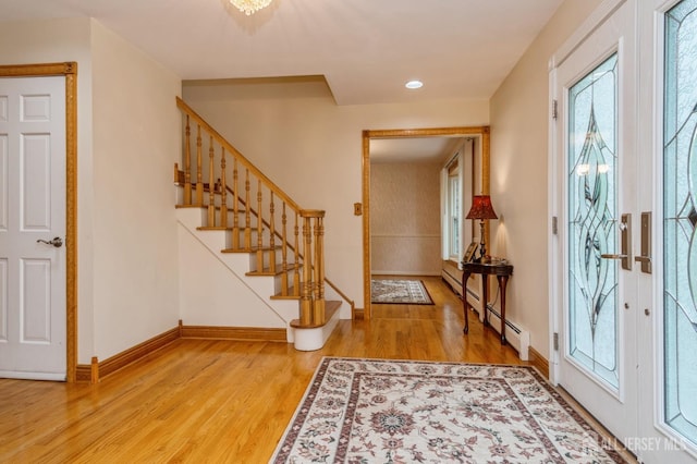 27 Briarwood Dr, Old Bridge, NJ 07747 - entryway featuring wood finished floors, stairway, a baseboard heating unit, baseboards, and recessed lighting