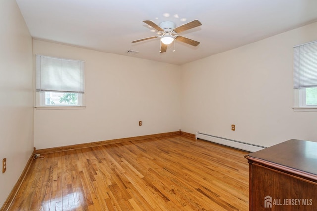 27 Briarwood Dr, Old Bridge, NJ 07747 - empty room featuring baseboard heating, light wood-type flooring, a ceiling fan, and baseboards