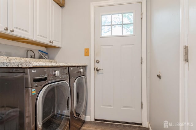27 Briarwood Dr, Old Bridge, NJ 07747 - laundry area with washer and dryer, cabinet space, wood finished floors, and baseboards