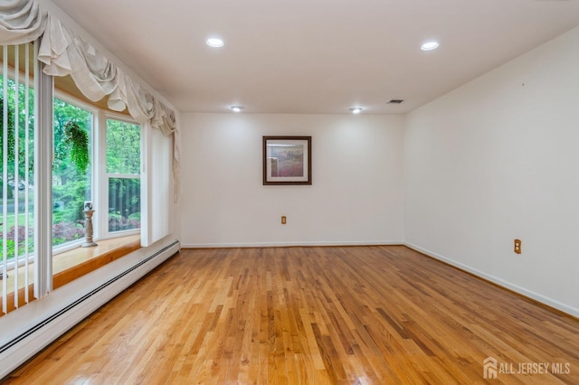 27 Briarwood Dr, Old Bridge, NJ 07747 - unfurnished room featuring baseboard heating, light wood finished floors, recessed lighting, and baseboards