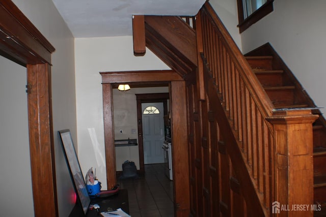 stairs featuring tile patterned floors