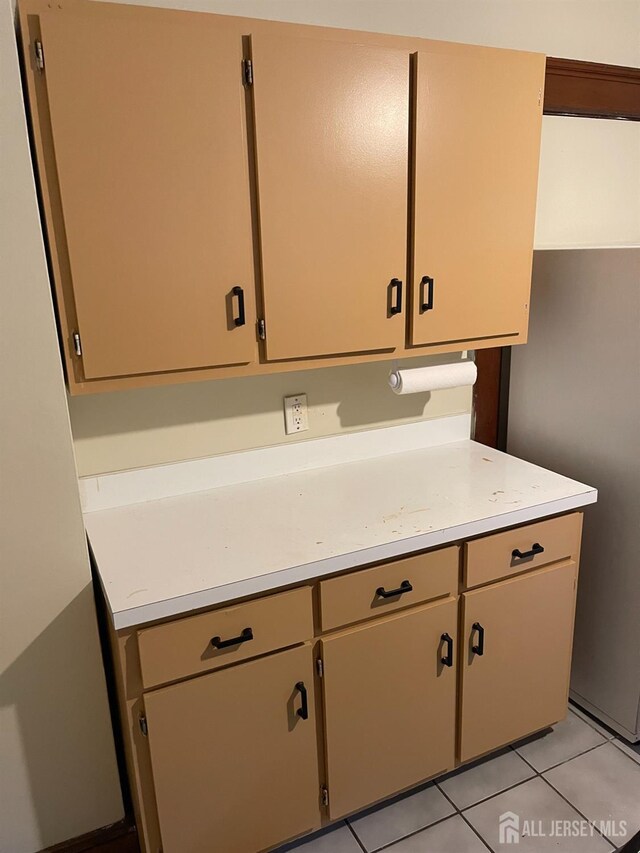 kitchen with light tile patterned floors