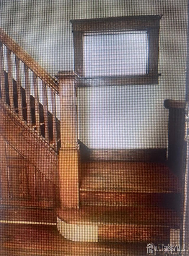 staircase with a wealth of natural light