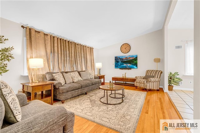 21 Wilk Rd, Edison, NJ 08837 - living room with vaulted ceiling, hardwood / wood-style flooring, and healthy amount of natural light