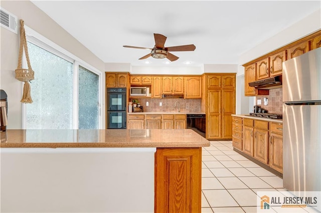21 Wilk Rd, Edison, NJ 08837 - kitchen with a ceiling fan, black appliances, decorative backsplash, and brown cabinets