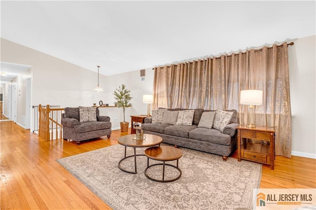 21 Wilk Rd, Edison, NJ 08837 - living room featuring wood finished floors and lofted ceiling