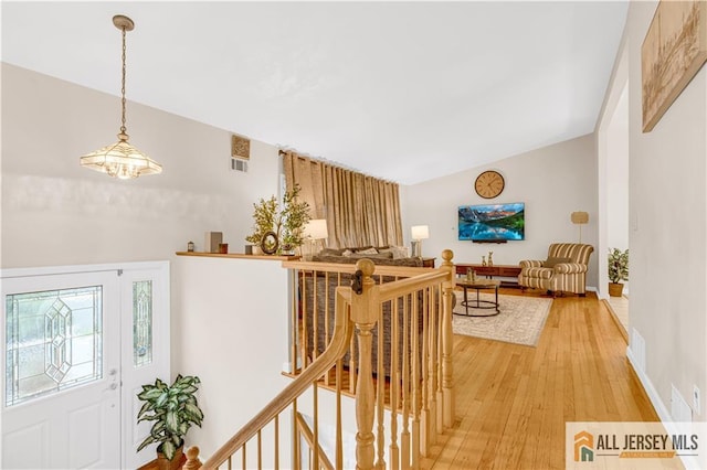 21 Wilk Rd, Edison, NJ 08837 - hall with an upstairs landing and light wood-style floors