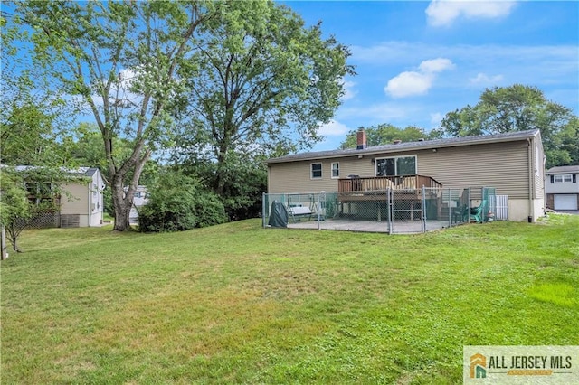 21 Wilk Rd, Edison, NJ 08837 - back of house with a lawn, a wooden deck, and a chimney