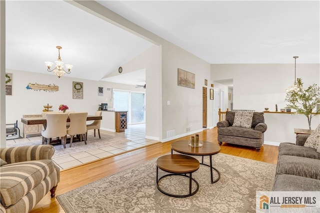 21 Wilk Rd, Edison, NJ 08837 - living room featuring a chandelier, wood finished floors, and lofted ceiling
