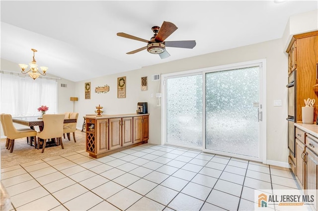 21 Wilk Rd, Edison, NJ 08837 - kitchen with a chandelier, a ceiling fan, light countertops, lofted ceiling, and hanging light fixtures