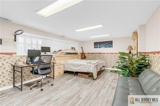 21 Wilk Rd, Edison, NJ 08837 - bedroom with wallpapered walls, light wood finished floors, an office area, and a wainscoted wall