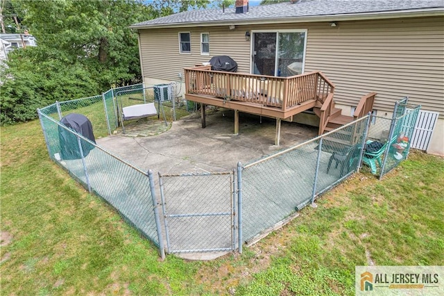 21 Wilk Rd, Edison, NJ 08837 - rear view of property featuring a gate, a shingled roof, a deck, a fenced backyard, and a patio area