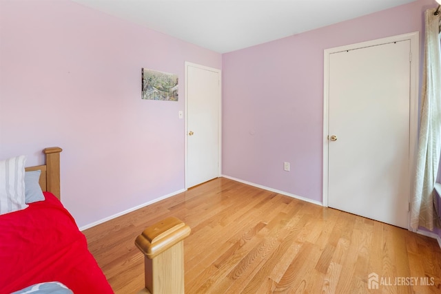 23 Boxwood Cir, Edison, NJ 08820 - unfurnished bedroom featuring light wood-style flooring and baseboards
