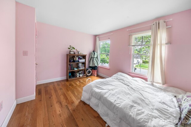 23 Boxwood Cir, Edison, NJ 08820 - bedroom with light wood-style flooring and baseboards