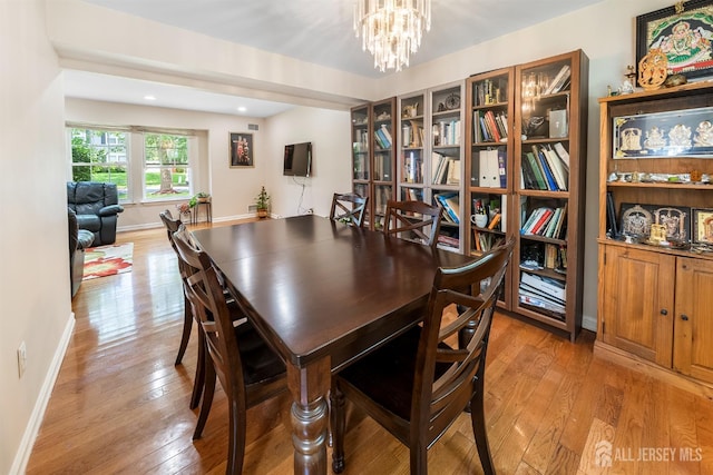 23 Boxwood Cir, Edison, NJ 08820 - dining space featuring light wood-style flooring and a chandelier