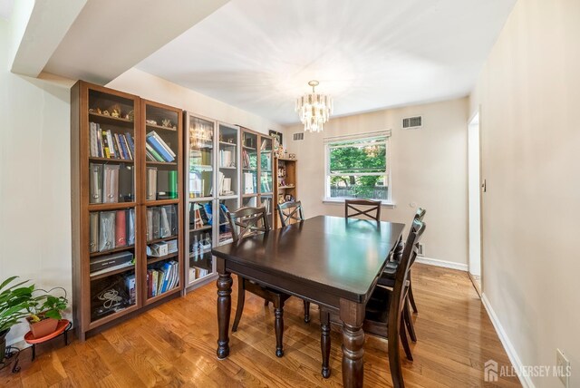 23 Boxwood Cir, Edison, NJ 08820 - dining area featuring a chandelier and light wood finished floors