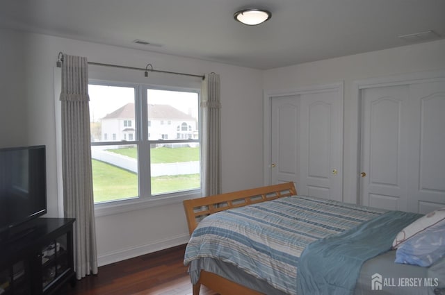 12 Sunny Ct, Monroe, NJ 08831 - bedroom featuring wood finished floors, two closets, and baseboards