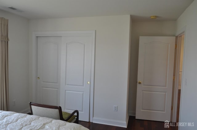 12 Sunny Ct, Monroe, NJ 08831 - bedroom with a closet, dark wood-style flooring, and baseboards