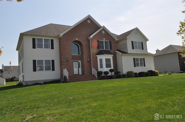 12 Sunny Ct, Monroe, NJ 08831 - traditional-style home with a front lawn, brick siding, and entry steps