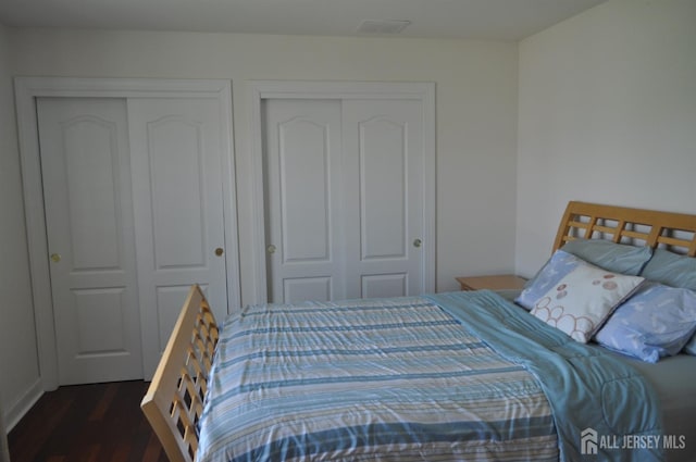 12 Sunny Ct, Monroe, NJ 08831 - bedroom featuring wood finished floors and two closets