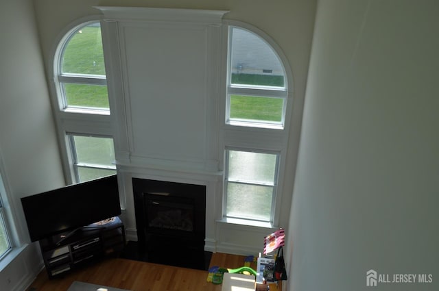 12 Sunny Ct, Monroe, NJ 08831 - living area with a large fireplace, wood finished floors, and plenty of natural light