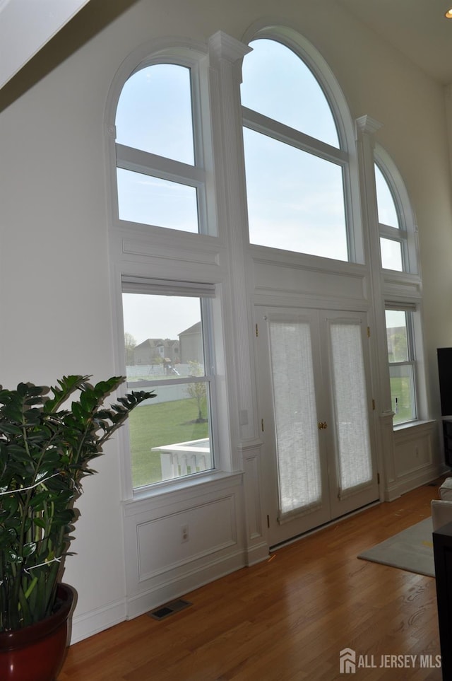 12 Sunny Ct, Monroe, NJ 08831 - entrance foyer featuring french doors, wood finished floors, a high ceiling, and plenty of natural light