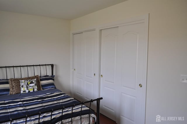 12 Sunny Ct, Monroe, NJ 08831 - bedroom featuring two closets and dark wood-type flooring