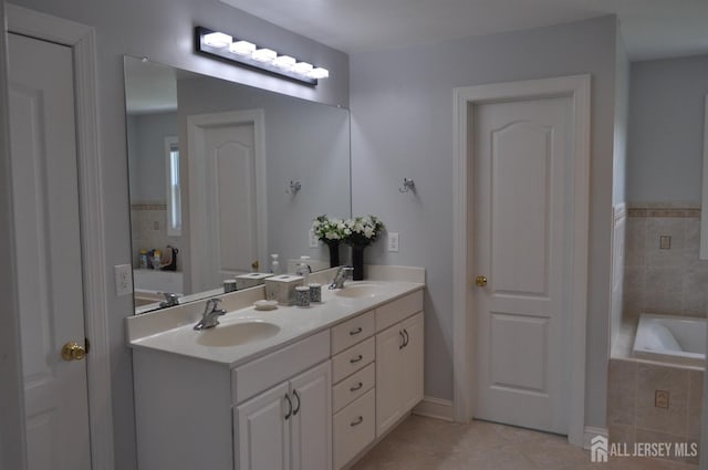 12 Sunny Ct, Monroe, NJ 08831 - full bathroom with tile patterned flooring, double vanity, and a relaxing tiled tub