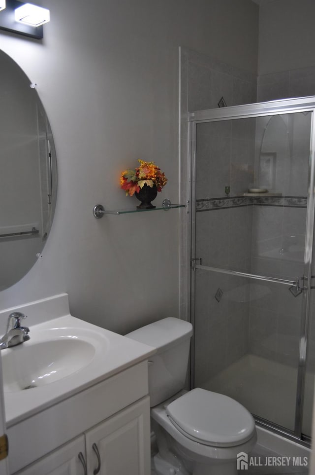 12 Sunny Ct, Monroe, NJ 08831 - full bathroom featuring vanity, toilet, and a shower stall