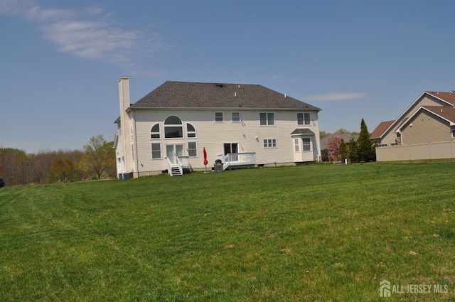 12 Sunny Ct, Monroe, NJ 08831 - rear view of house featuring a chimney and a yard