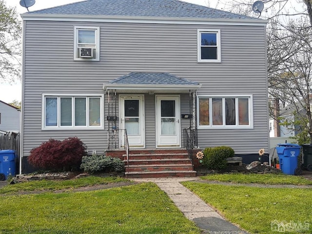 view of front facade with a front yard