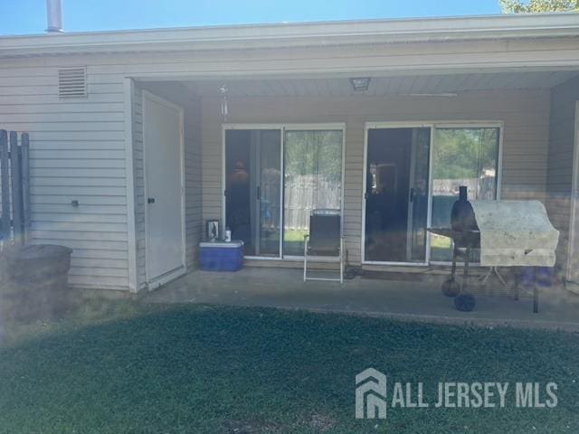 rear view of property with a patio area