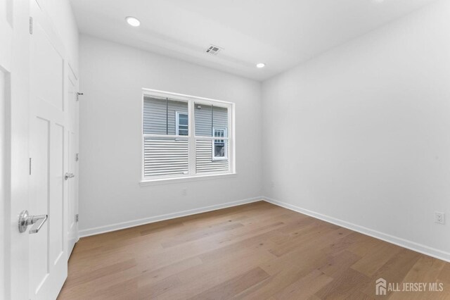243 E 9th Ave, Roselle, NJ 07203 - unfurnished room with wood finished floors and recessed lighting